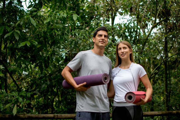 istock Beautiful yoga couple looking away 1031624596