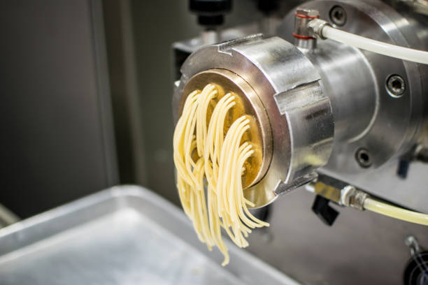 istock Close up of a machine making fresh spaghetti 1031629346