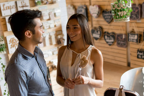 istock Happy couple at a wedding shop looking for keepsakes 1031629696