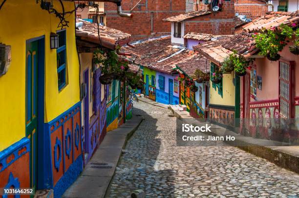 Houses With Wall Painted In Colourful Emblems Or Symbols Representing The People Living At Guatape Near Medellin Colombia Stock Photo - Download Image Now