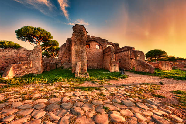 istock Sunset glimpse from cobblestones street in  Ancient Ostia ruins  - Rome 1031650066