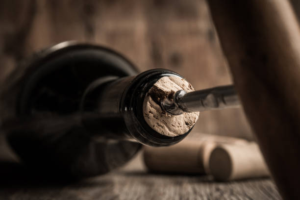 istock Corkscrew and bottle of wine on the board 1031650446