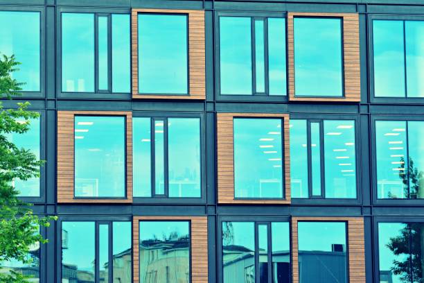istock Modern office building on a clear sky background. Retro stylized colorful tonal filter effect 1031655730