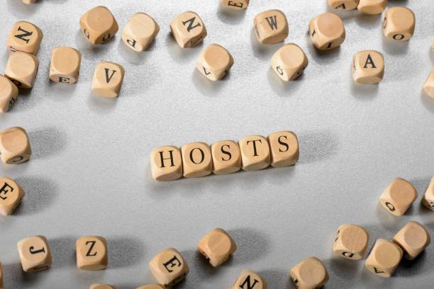 istock Hosts word on wooden cubes. Hosts concept 1031672634