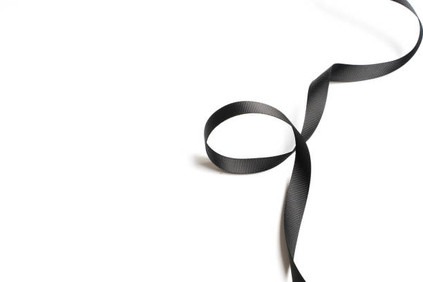 istock beautiful black ribbon twist spiral isolated on white background 1031686696
