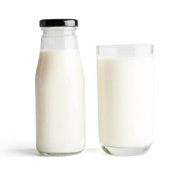 istock Milk bottle and milk glass on white background 1031686712