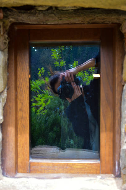 istock Reflection of a photographer in motion 1031692368