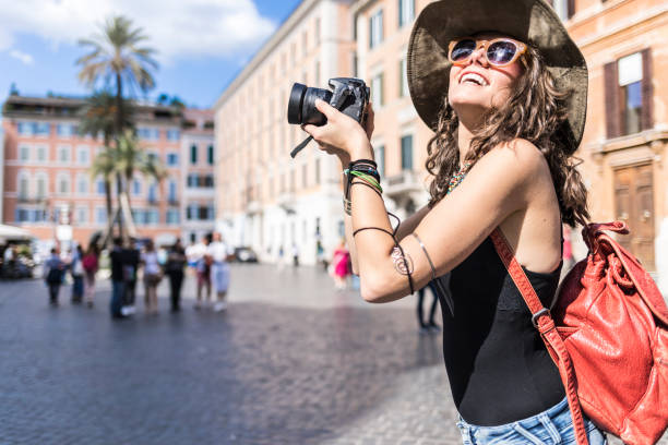 istock Side view of beautiful woman with camera 1031705476