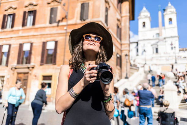istock Beautiful woman with camera looking up 1031705478