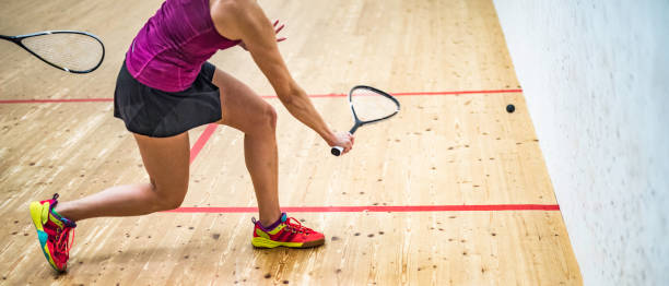 istock Female squash player hitting the ball 1031705694
