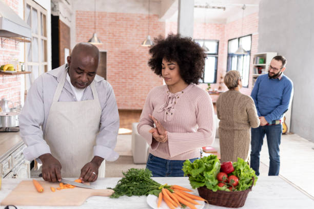 istock Father and daughter preparing salad at home 1031705758