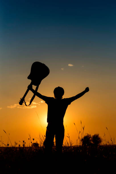 istock Silhouette of a Musician 1031706136