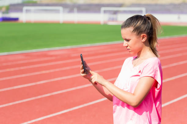 istock Woman with Tablet Computer at the Stadium 1031706146