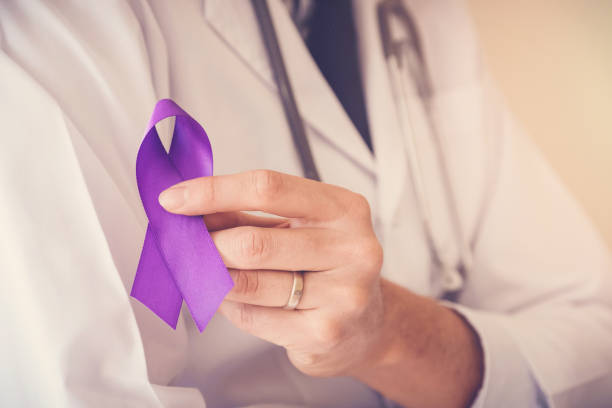 doctor hands holding purple ribbons, alzheimer disease, epilepsy awareness - domestic issues imagens e fotografias de stock