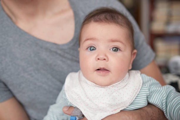 istock cute baby in her father's arms 1031709344