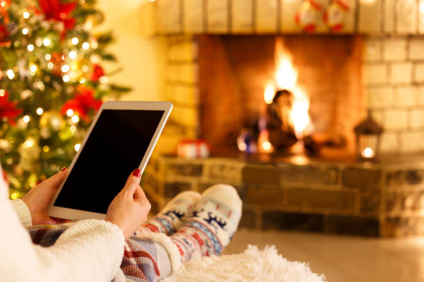 istock Woman sitting by fireplace 1031719602