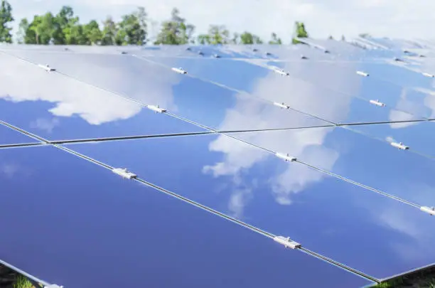 Close up array of  thin film solar cells or amorphous silicon solar cells or photovoltaics in solar power plant turn up skyward absorb the sunlight from the sun use light energy to generate electricity
