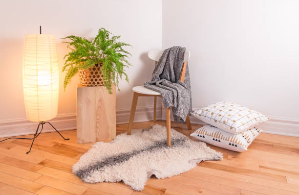 Room with cozy light decorated in Scandinavian style Room with cozy light decorated in Scandinavian style, using natural materials. lamp shade stock pictures, royalty-free photos & images