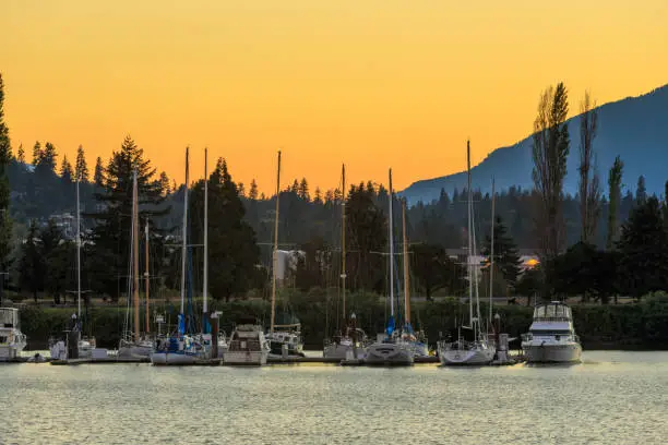 Boats dock at the Port of Hood River Marina on the Columbia River, Oregon state at sunset