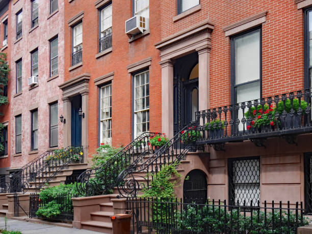 istock front steps of New York brownstone apartment buildings 1031737332