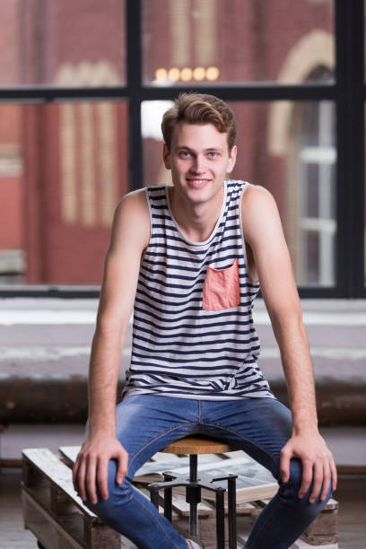 istock Male model with blue eyes and light brown curly hair 1031759266