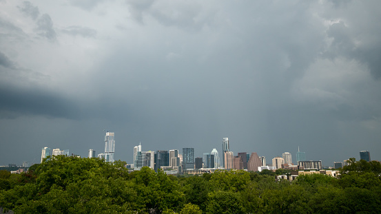 Austin Skyscrapers Over Green Trees with Storm on the Horizon