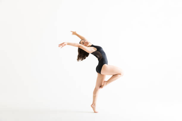 istock Woman In Ballet Costume Dancing Over White Background 1031765258