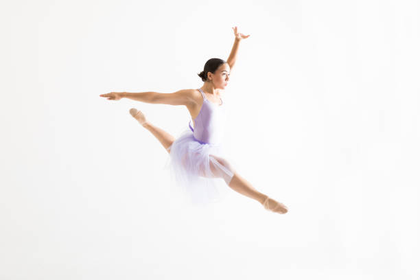istock Young Ballerina Doing Splits In The Air Against White Background 1031765418