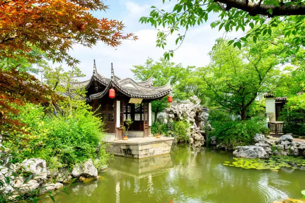 Wuxi, China, a garden of ancient architecture, the text on the pavilion is the introduction of the garden name and garden