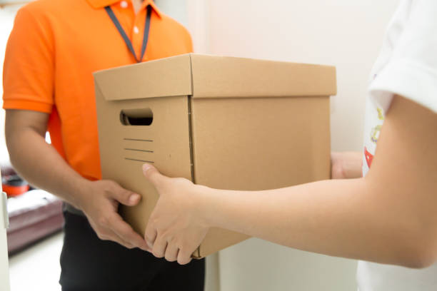 istock Customers receive goods from delivery man 1031775434