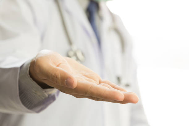 istock Male doctor showing hand on white background 1031775548