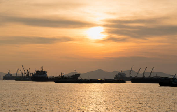 istock Cargo ship parked in the sea. 1031786498