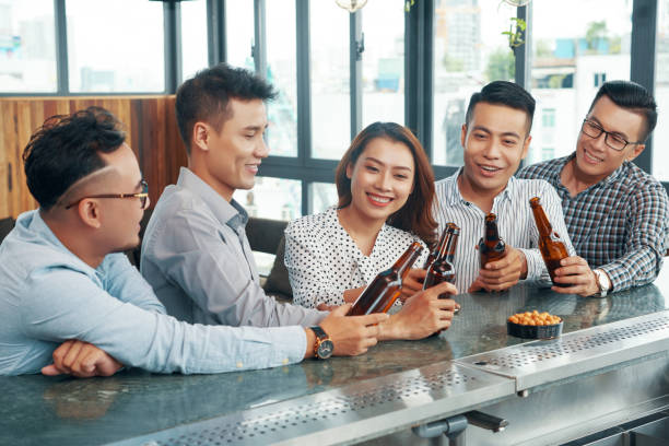 istock Colleagues celebrating success in bar 1031789530