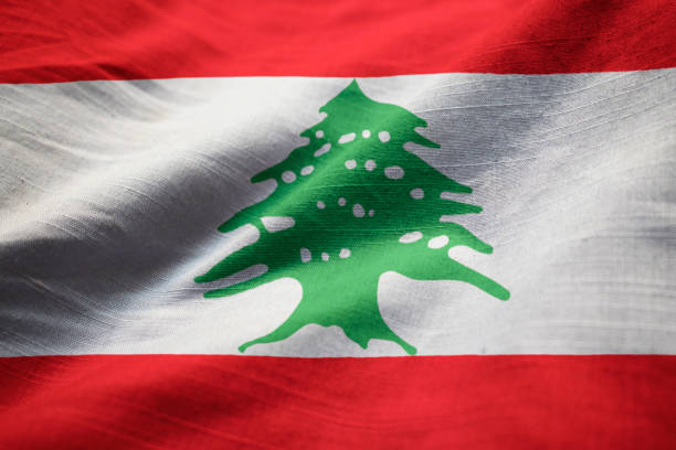 closeup of ruffled lebanon flag - lebanese flag imagens e fotografias de stock