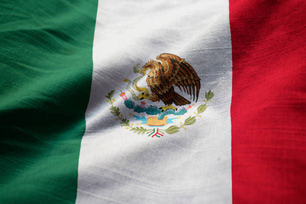 istock Closeup of Ruffled Mexico Flag 1031799720