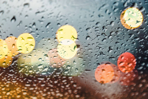 istock raindrops on the glass with lights 1031803094