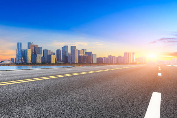 istock Empty asphalt road and modern buildings in Hangzhou at sunrise 1031806708