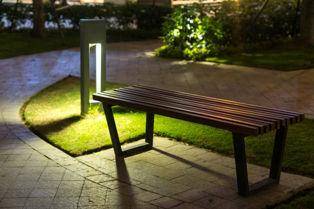 istock Garden glowing decoration light in the park at night with park bench 1031809044