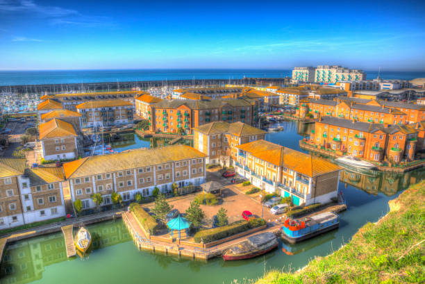 Brighton marina, boats, yachts and apartments East Sussex England UK bright colourful HDR Brighton marina and harbour boats and yachts East Sussex England UK near Eastbourne in bright colourful HDR brighton england stock pictures, royalty-free photos & images