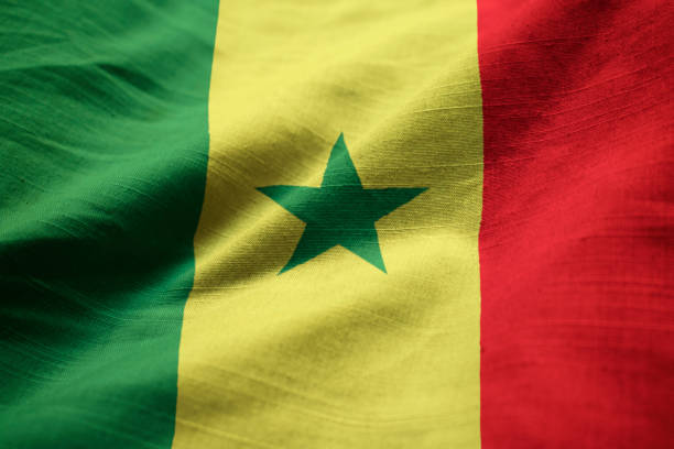 Closeup of Ruffled Senegal Flag Closeup of Ruffled Senegal Flag, Senegal Flag Blowing in Wind senegal flag stock pictures, royalty-free photos & images