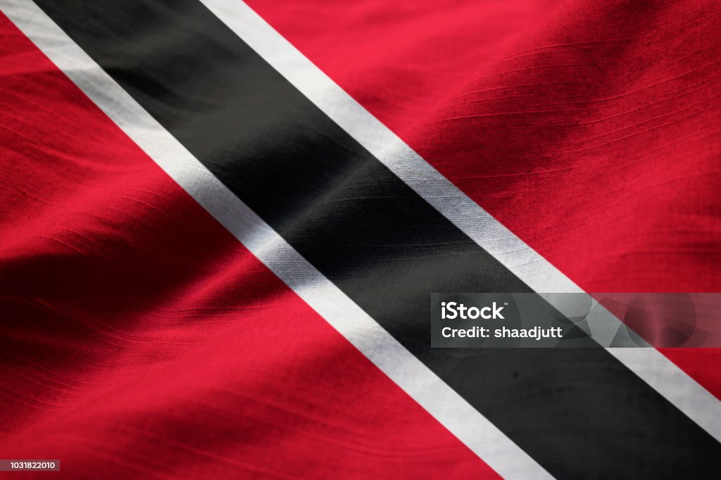 Closeup of Ruffled Trinidad and Tobago Flag Closeup of Ruffled Trinidad and Tobago Flag, Trinidad and Tobago Flag Blowing in Wind Trinidad - Trinidad And Tobago Stock Photo