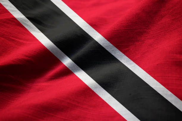 Closeup of Ruffled Trinidad and Tobago Flag Closeup of Ruffled Trinidad and Tobago Flag, Trinidad and Tobago Flag Blowing in Wind tobago stock pictures, royalty-free photos & images