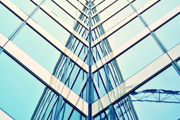 istock Modern office building on a clear sky background. Retro stylized colorful tonal filter effect 1031822118