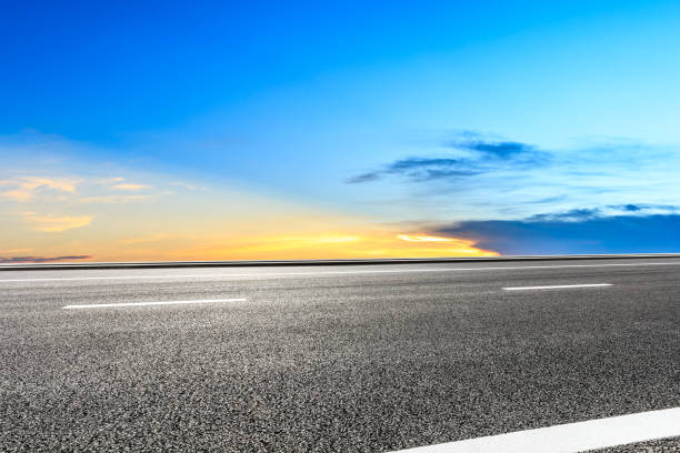 istock Asphalt highway and beautiful sky clouds at sunset 1031822260