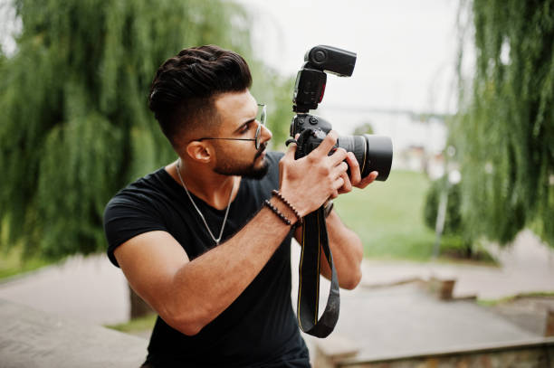 istock Awesome beautiful tall ararbian beard macho man photographer 1031825318
