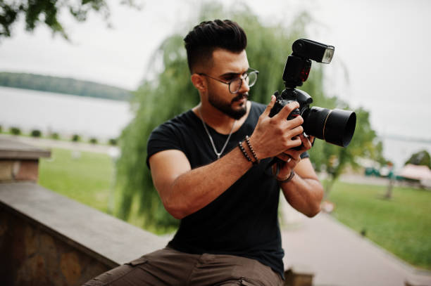 istock Awesome beautiful tall ararbian beard macho man photographer 1031825334