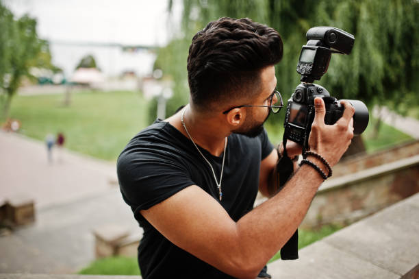 istock Awesome beautiful tall ararbian beard macho man photographer 1031825352
