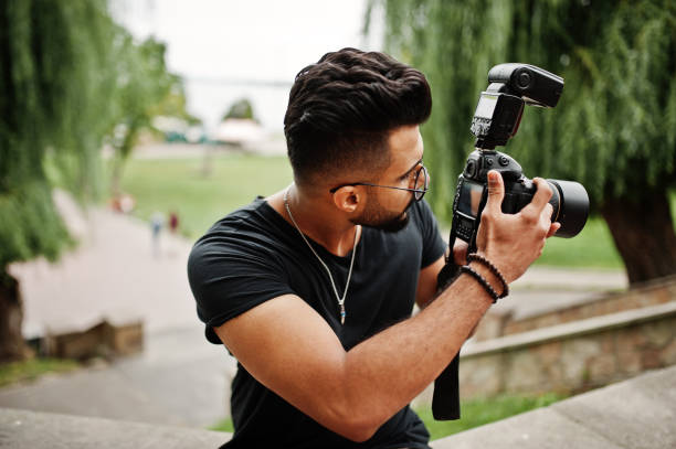 istock Awesome beautiful tall ararbian beard macho man photographer 1031825354