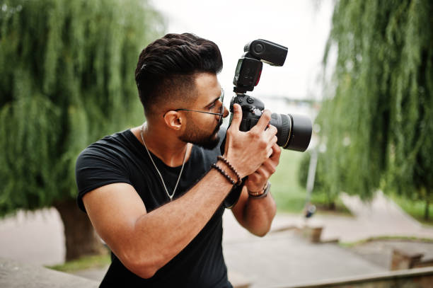istock Awesome beautiful tall ararbian beard macho man photographer 1031825380