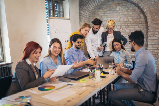 istock Business people working in office together. Team work in office. 1031826372